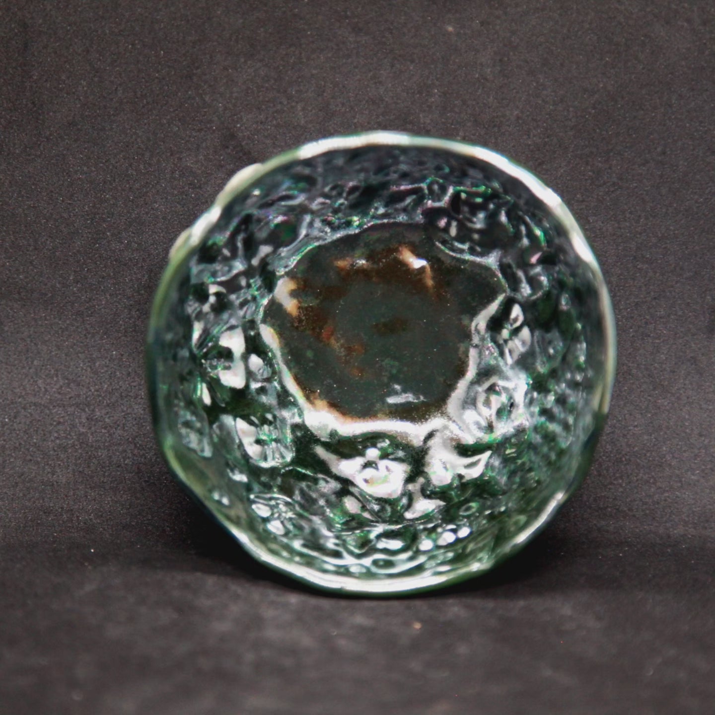 Metal green cup on light green clay - flower patterns