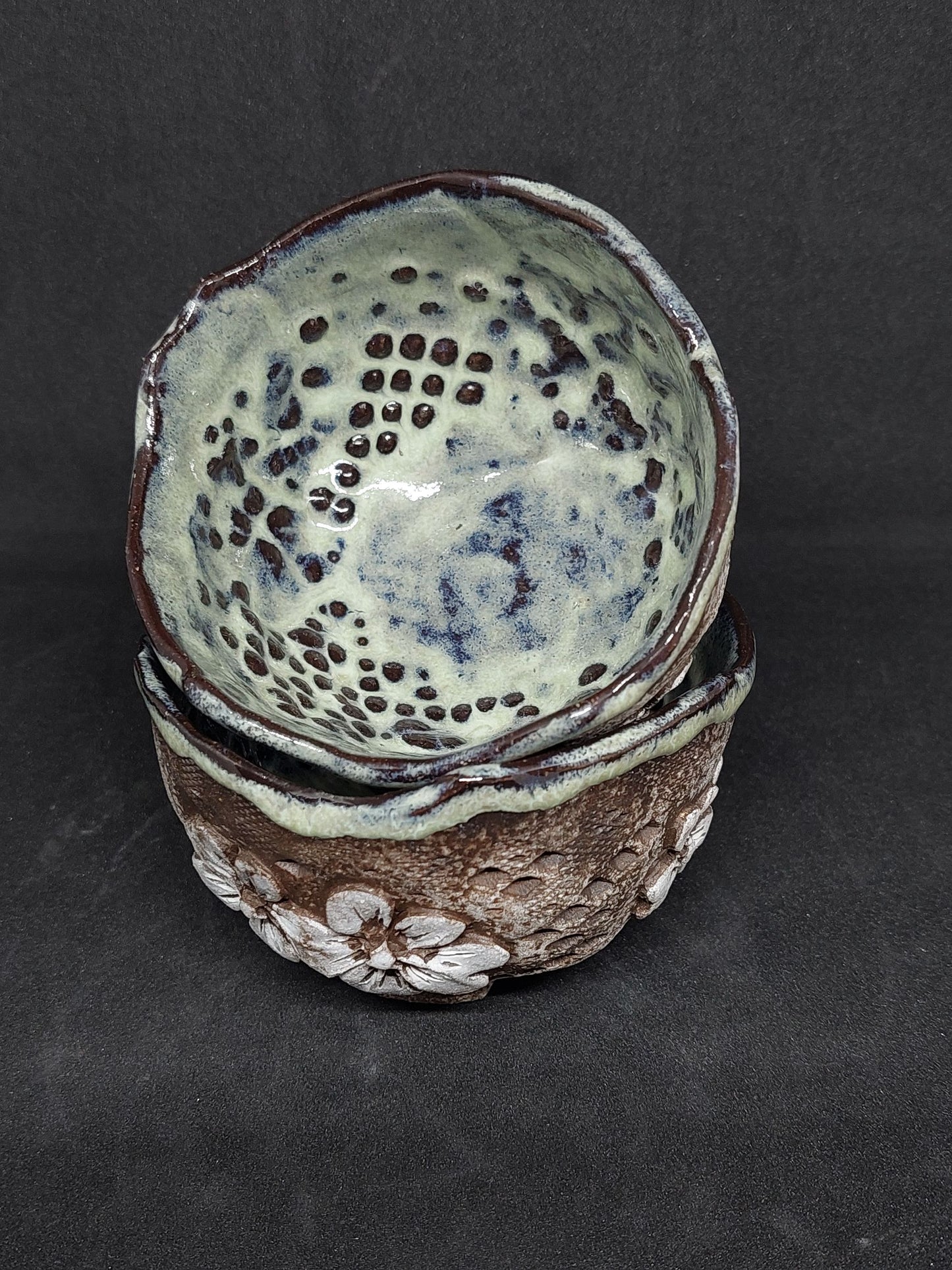 Green cups on black clay - flower patterns