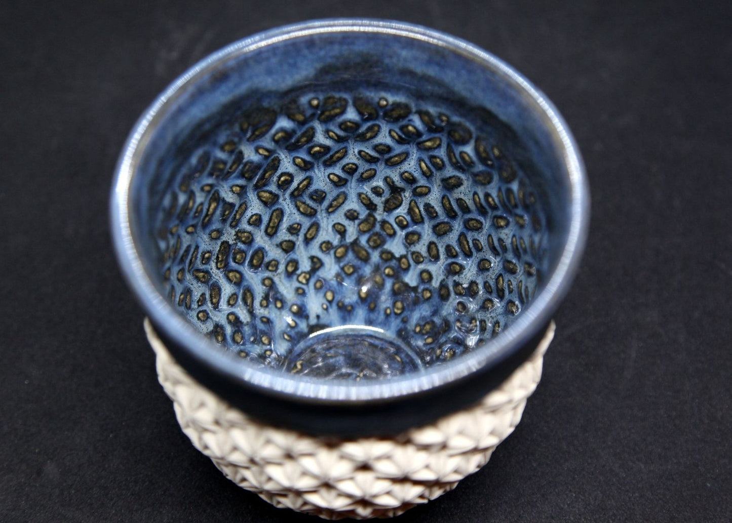 Blue bowl on white clay - origami pattern