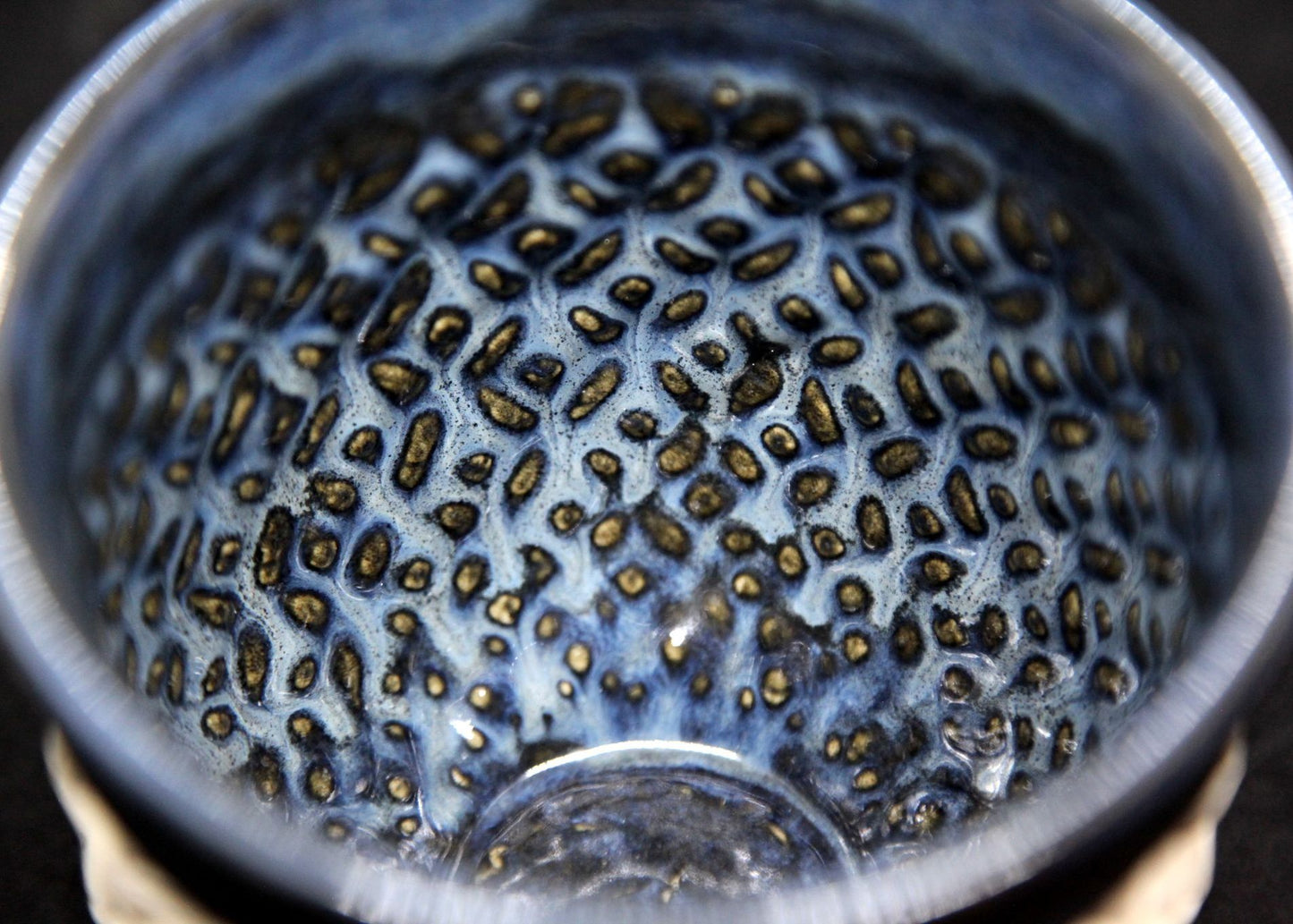 Blue bowl on white clay - origami pattern