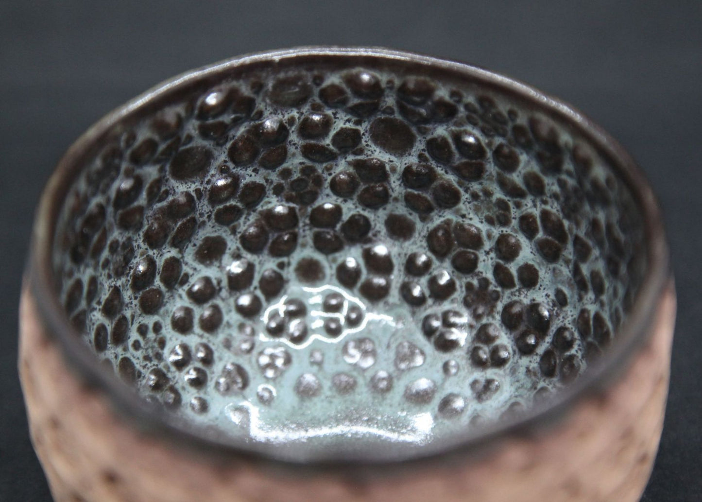 Blue and brown bowl on buff clay - prism pattern