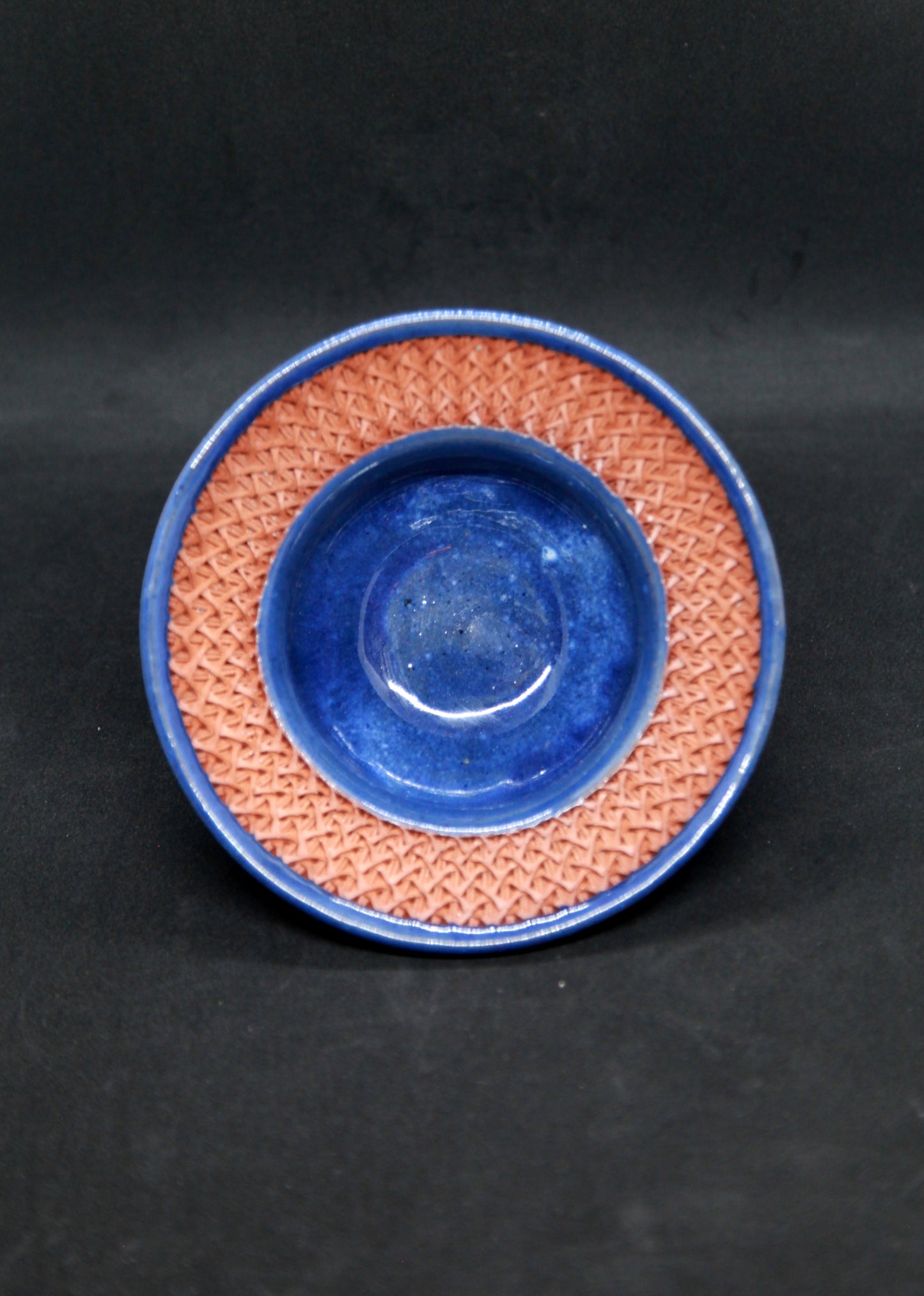 Blue marli bowl on red glaze - braiding pattern