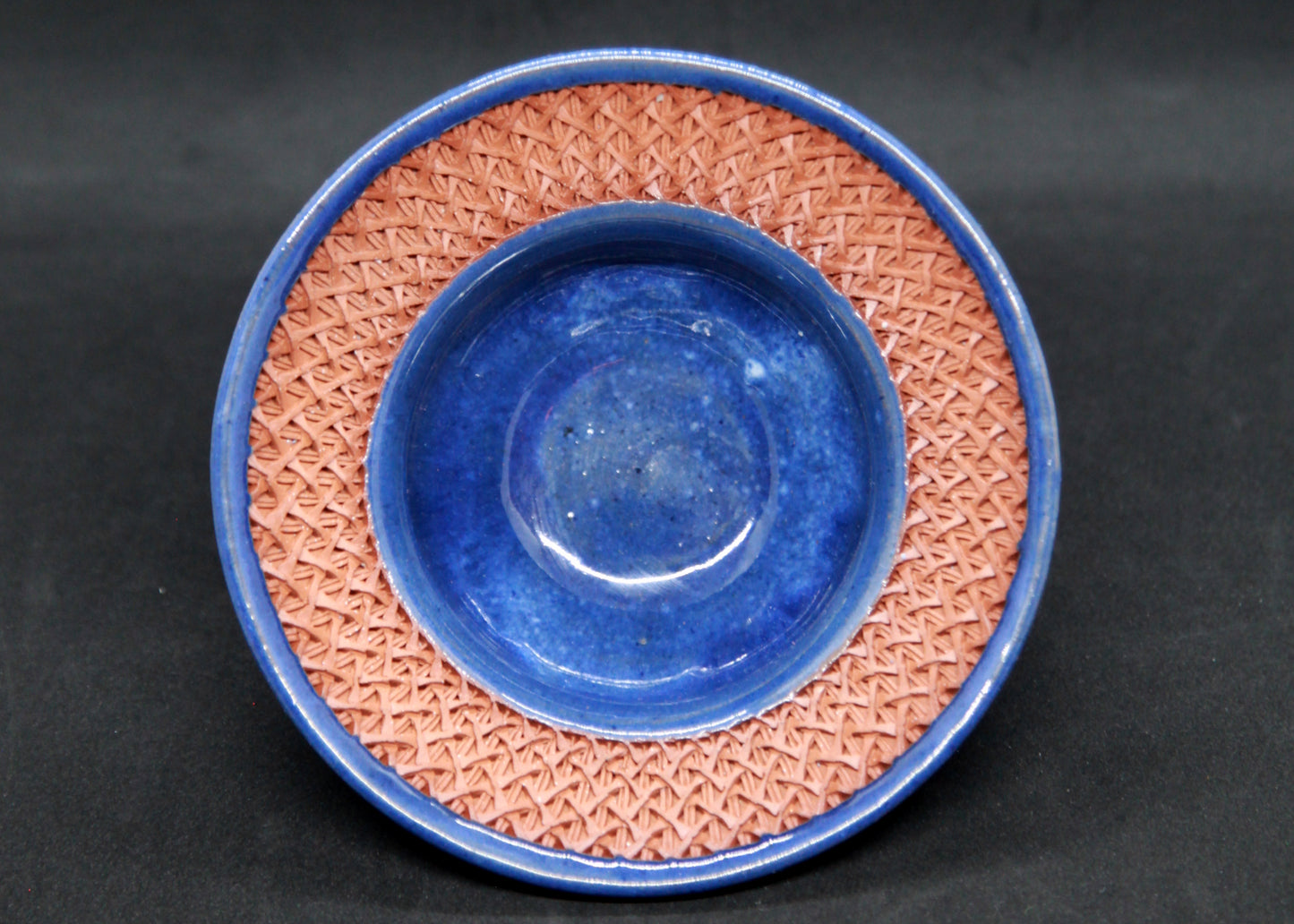 Blue marli bowl on red glaze - braiding pattern