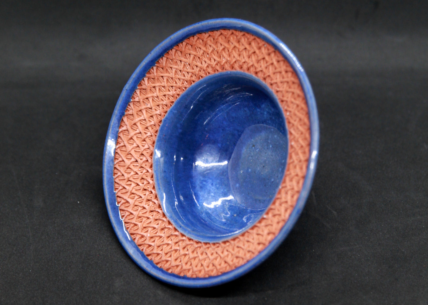 Blue marli bowl on red glaze - braiding pattern