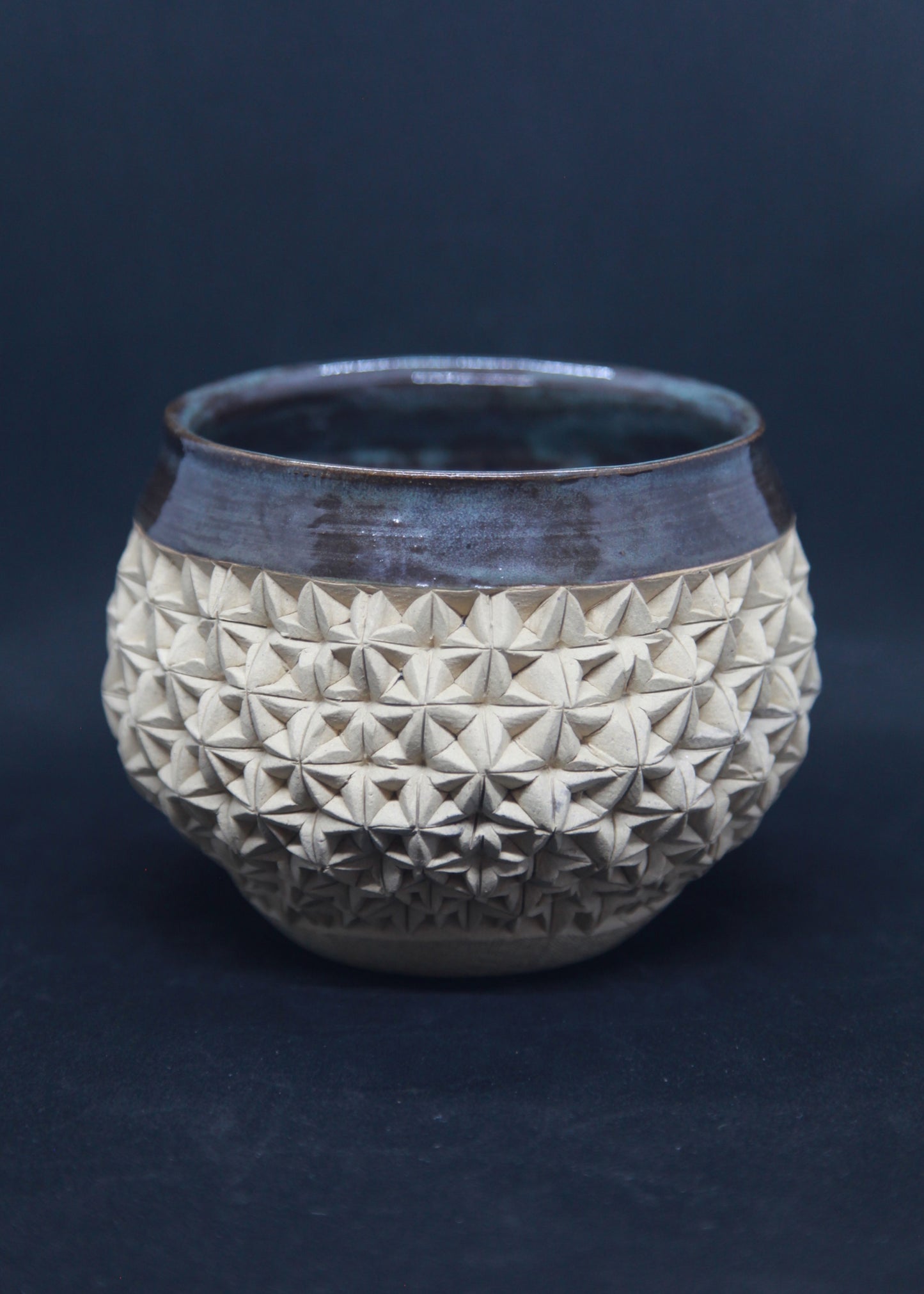 Brown and green bowl on ivory clay - origami pattern