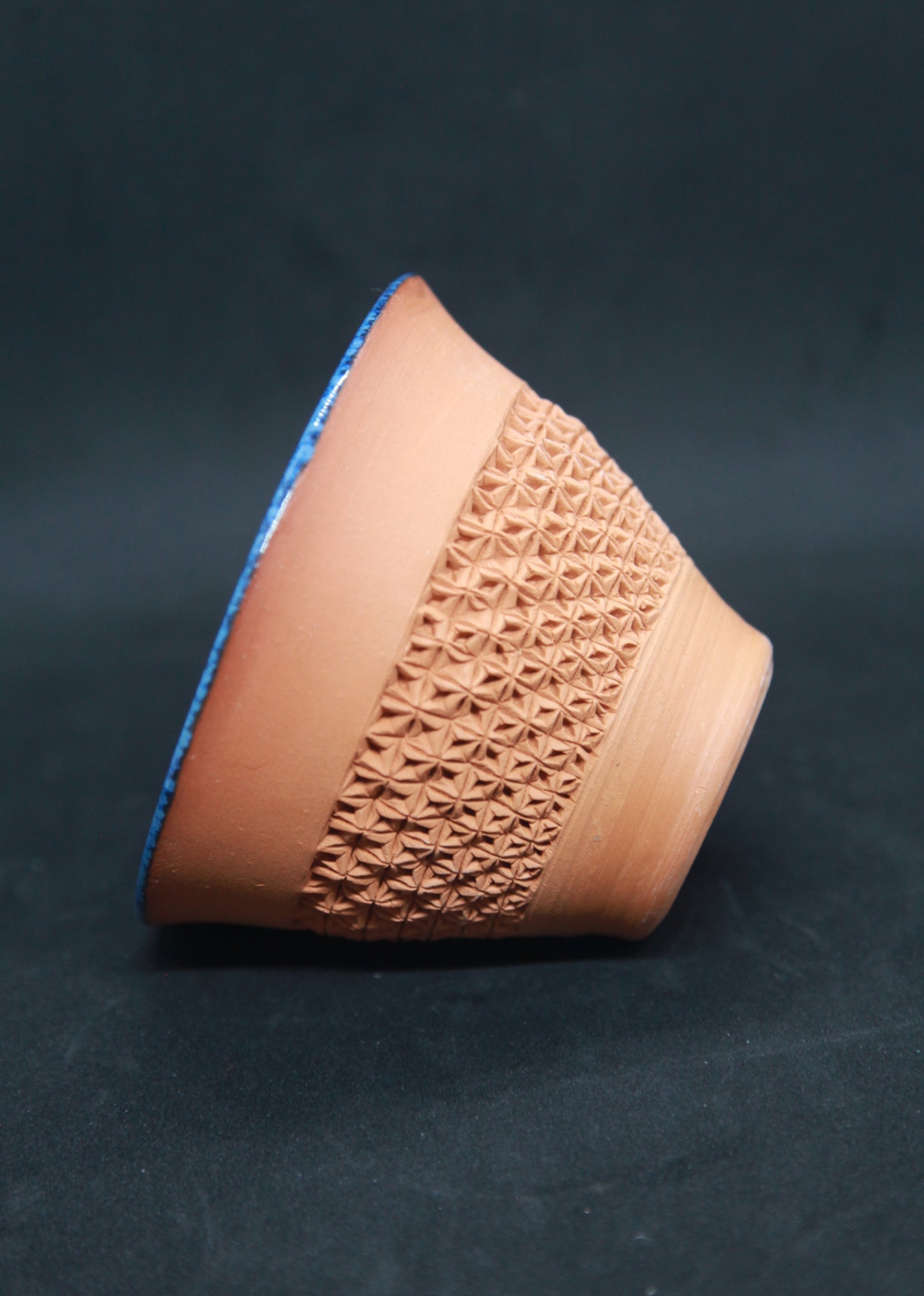 Blue mug on white ground - origami pattern