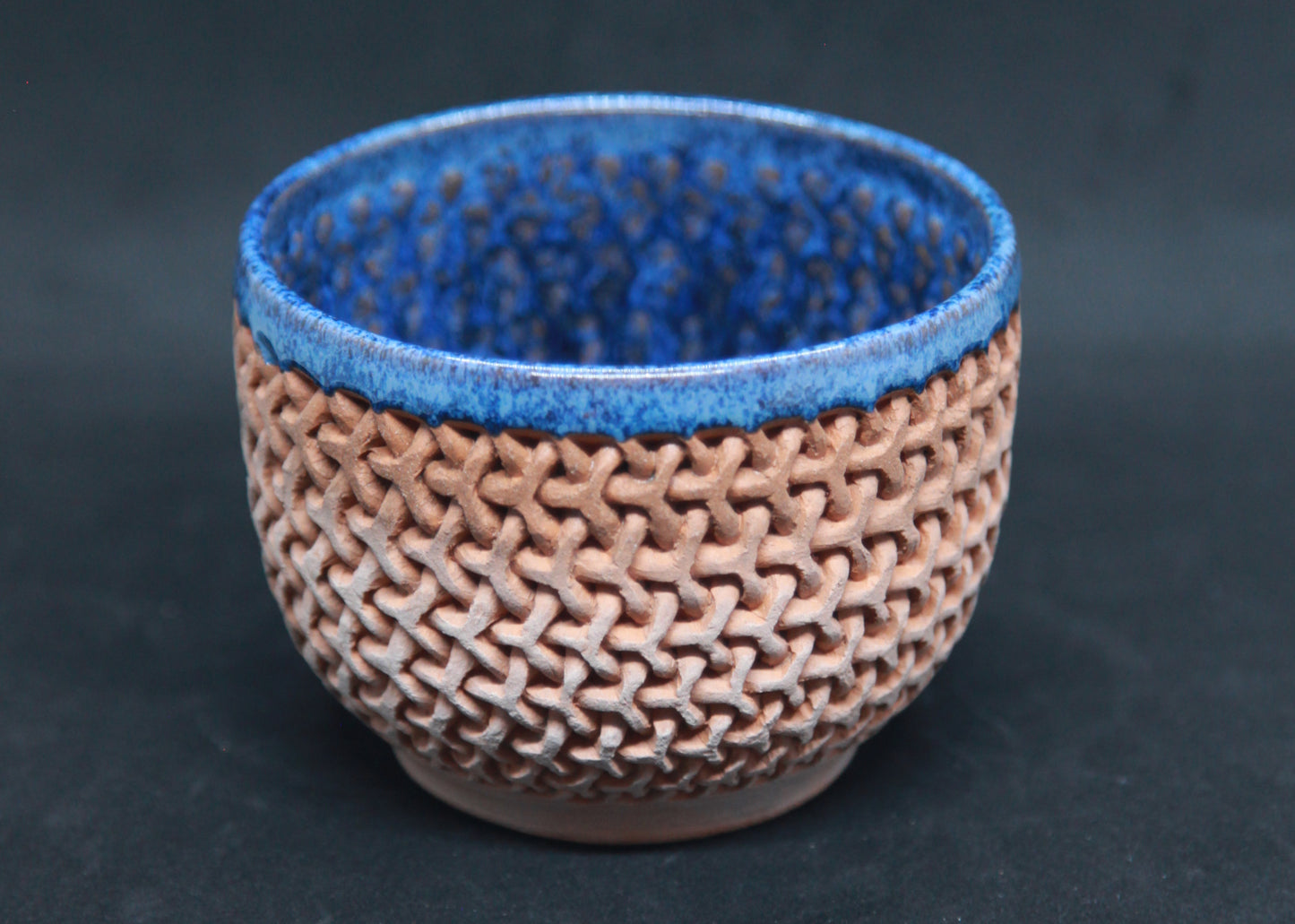Blue bowl on red glaze - mesh pattern