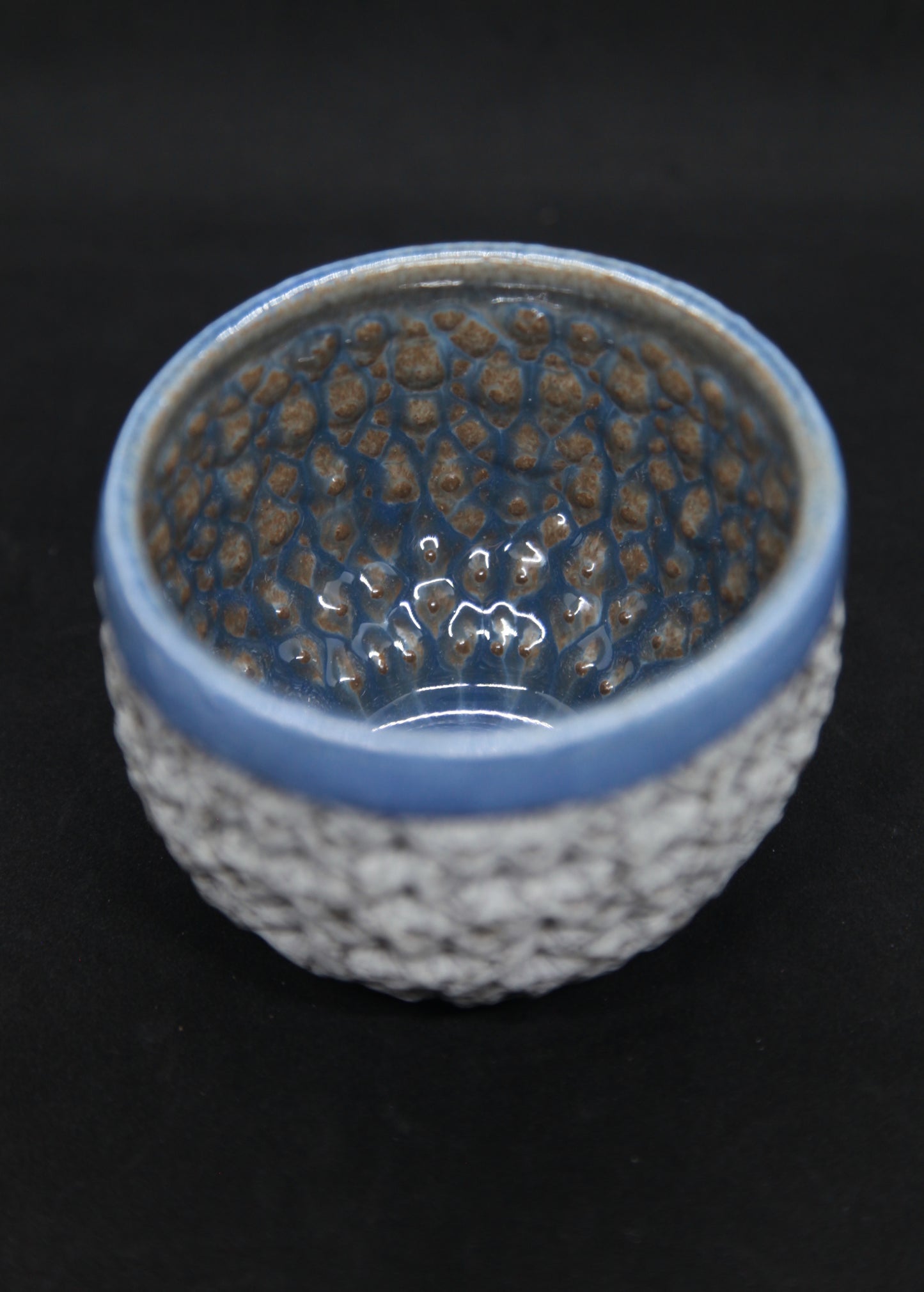 Blue bowl on gray clay, white engobe - hydrangea pattern
