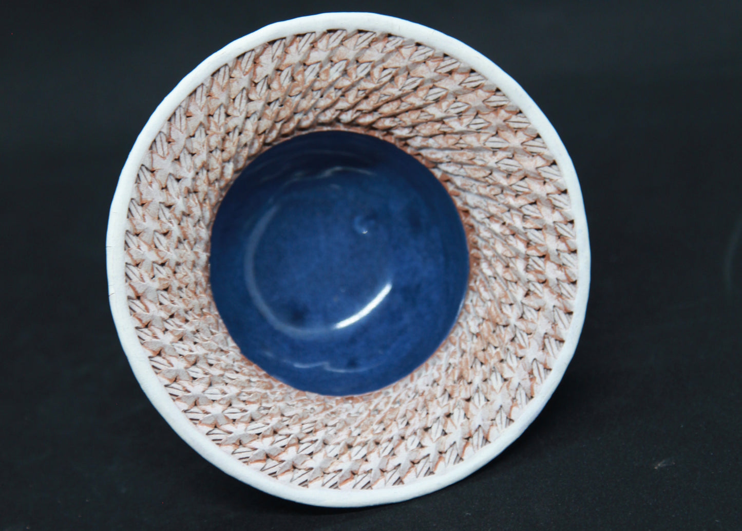 Blue and white marli bowl on red glaze - braiding pattern