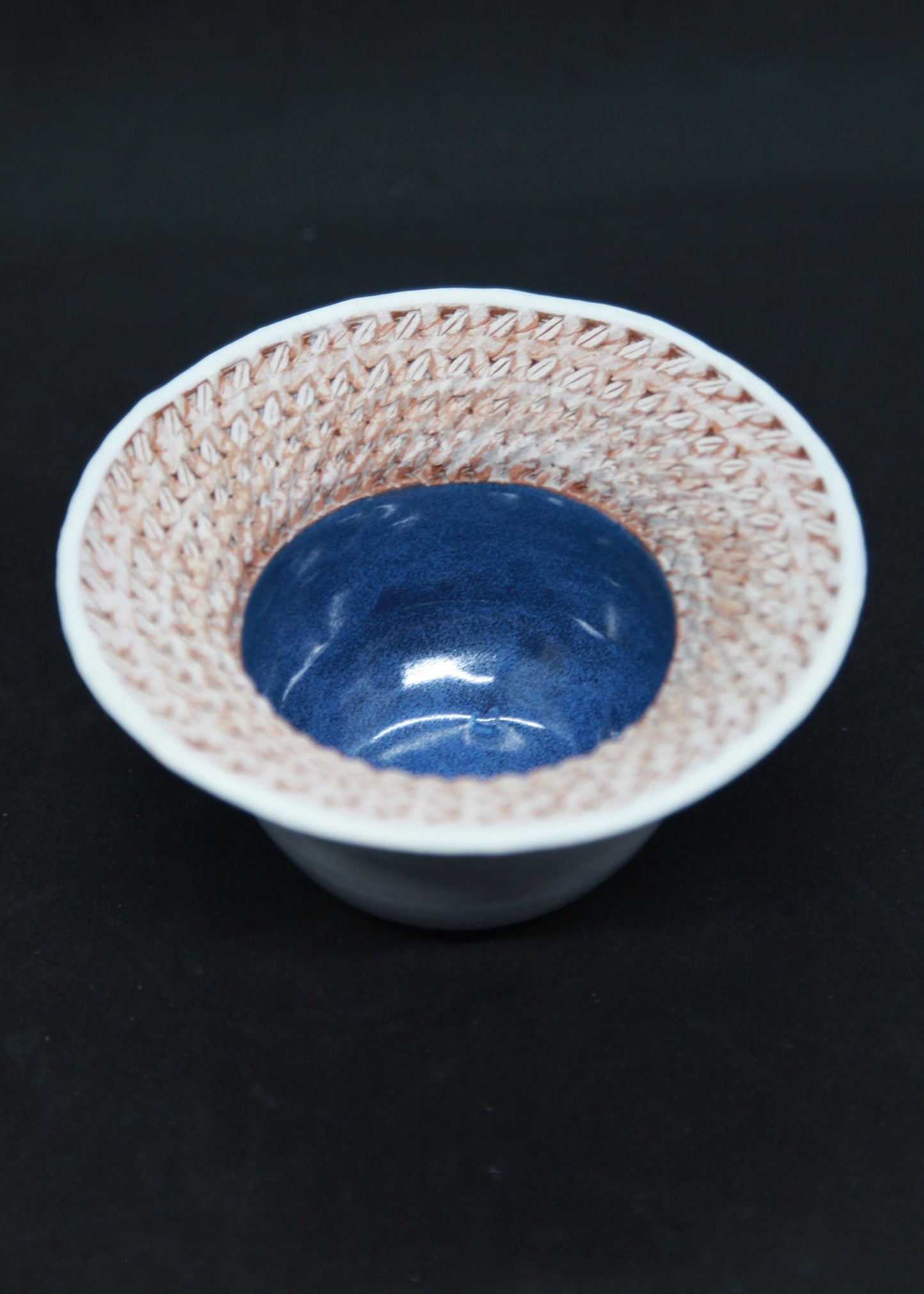 Blue and white marli bowl on red glaze - braiding pattern