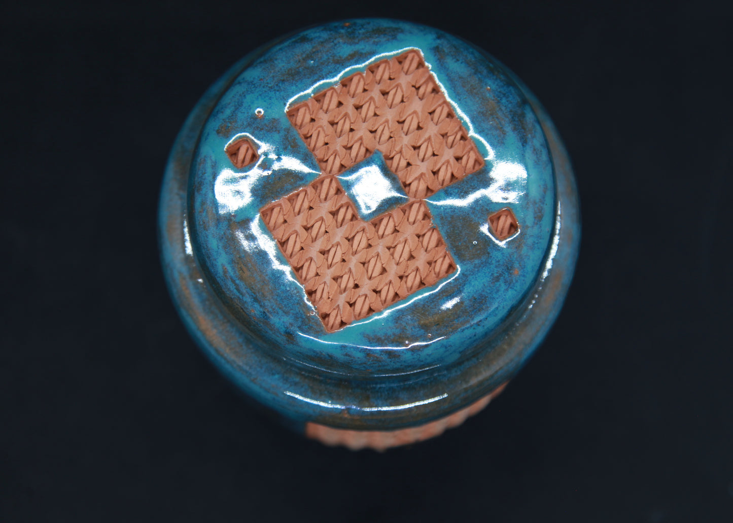 Turquoise blue tea box on red clay - braiding pattern