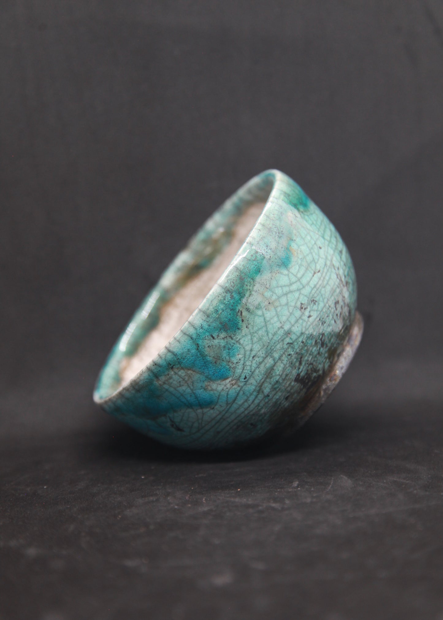 Turquoise and white raku bowl