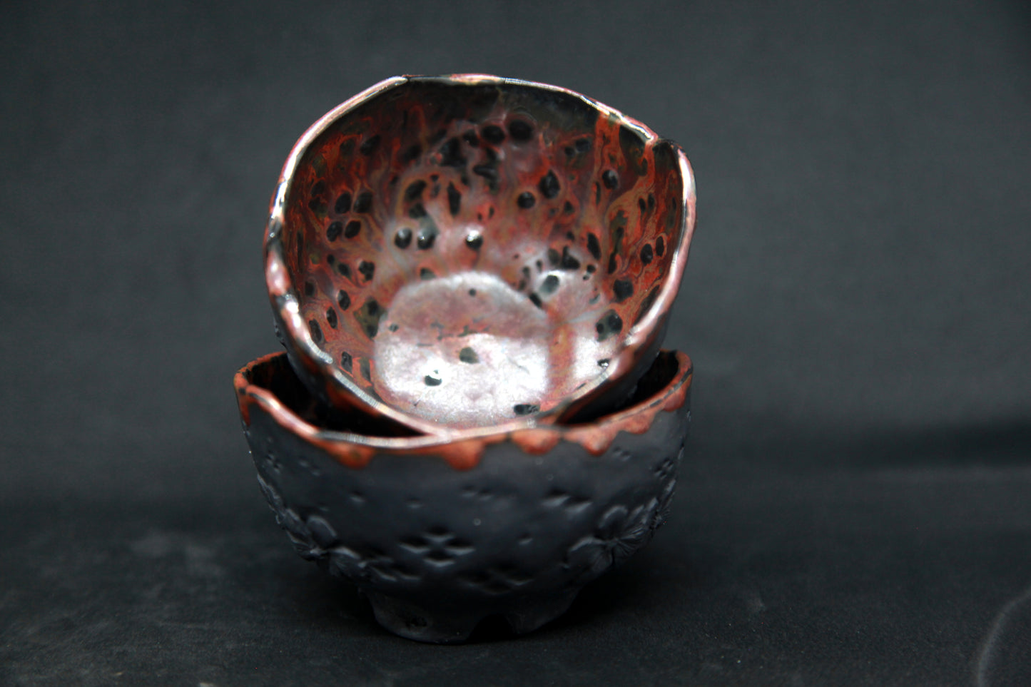 Carmin red cups on red clay - flower patterns