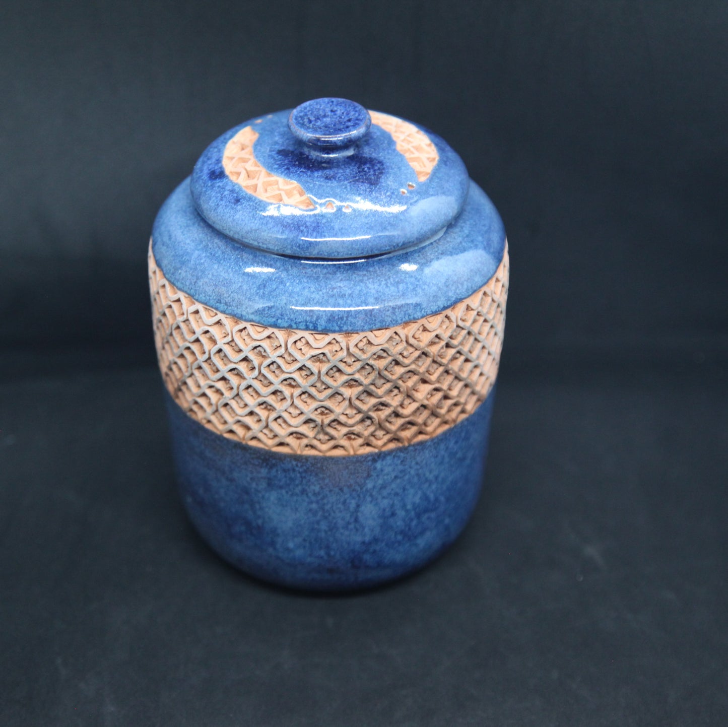 Turquoise blue tea box on red clay - braiding pattern