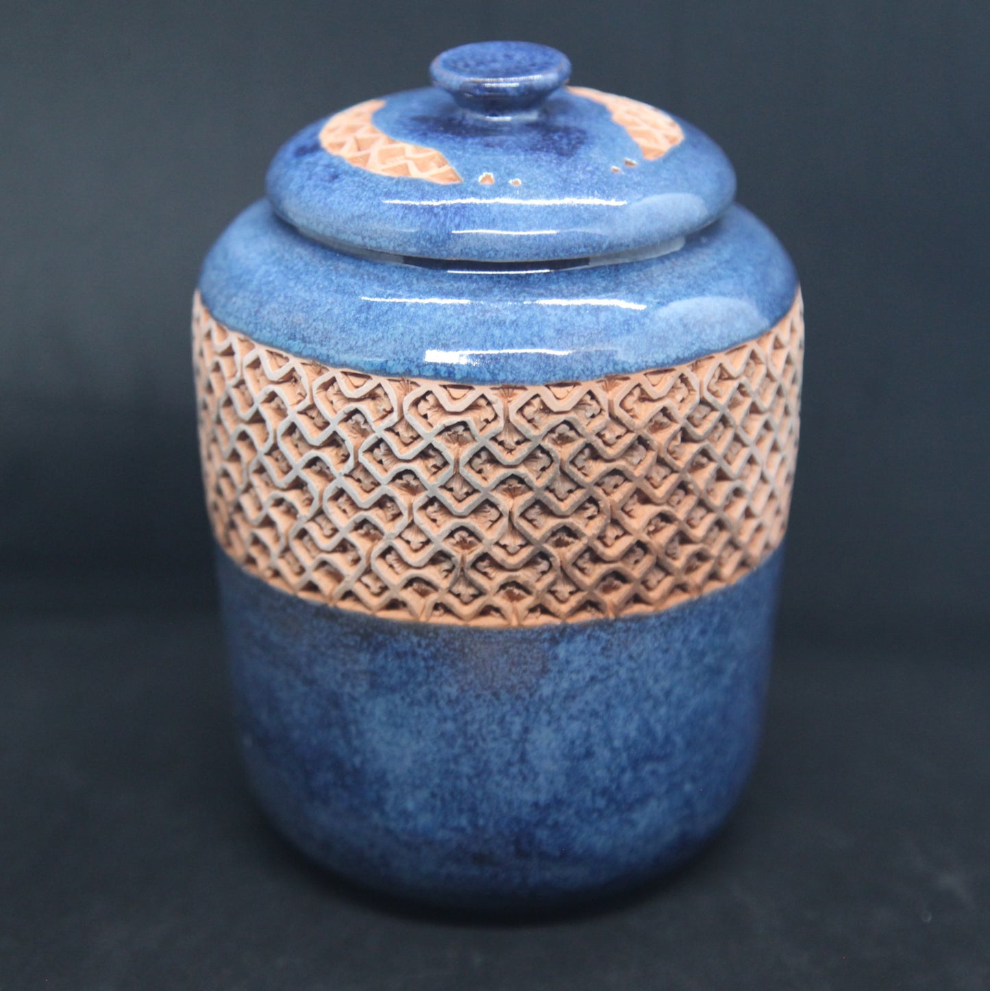 Turquoise blue tea box on red clay - braiding pattern