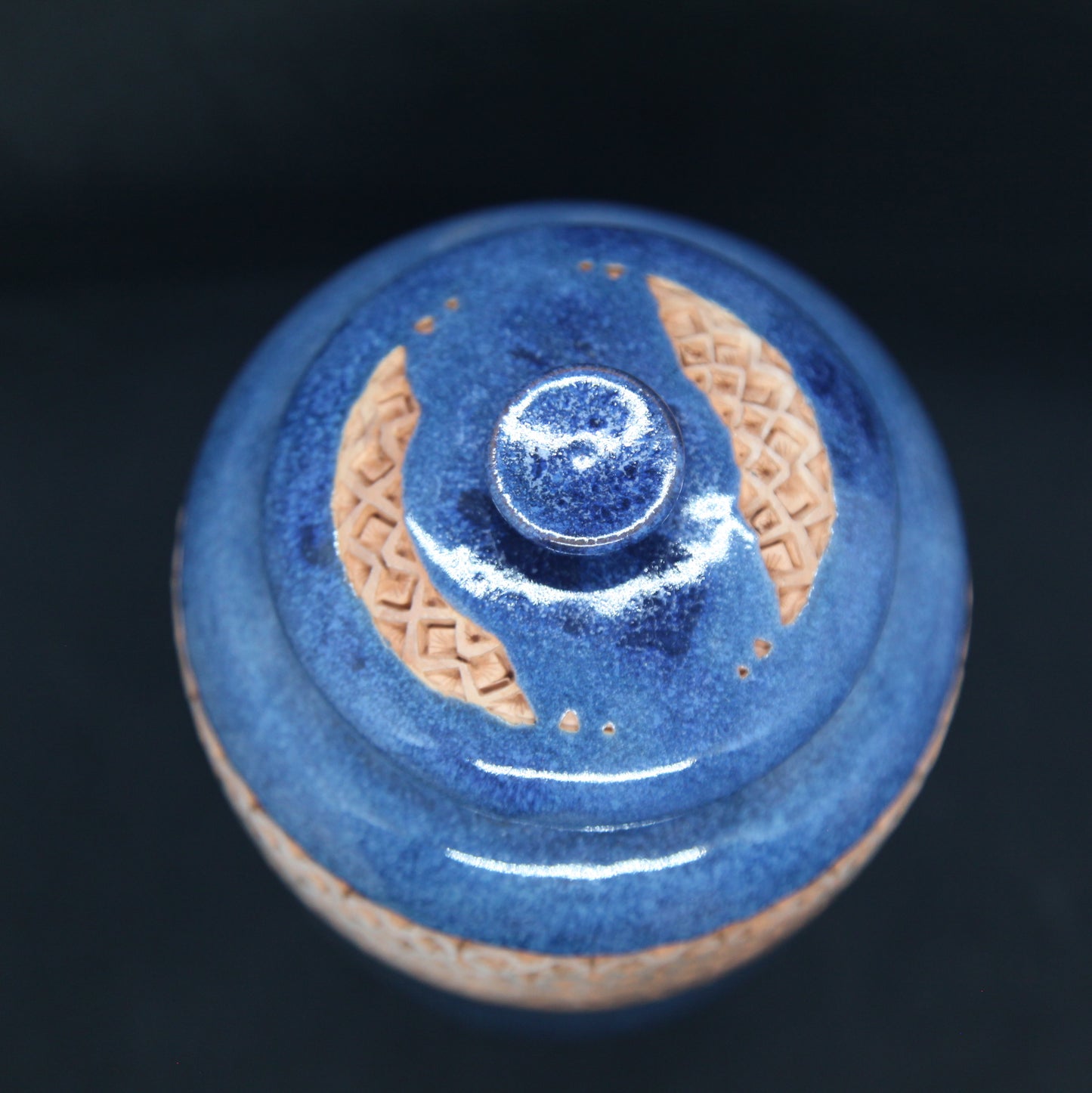 Turquoise blue tea box on red clay - braiding pattern