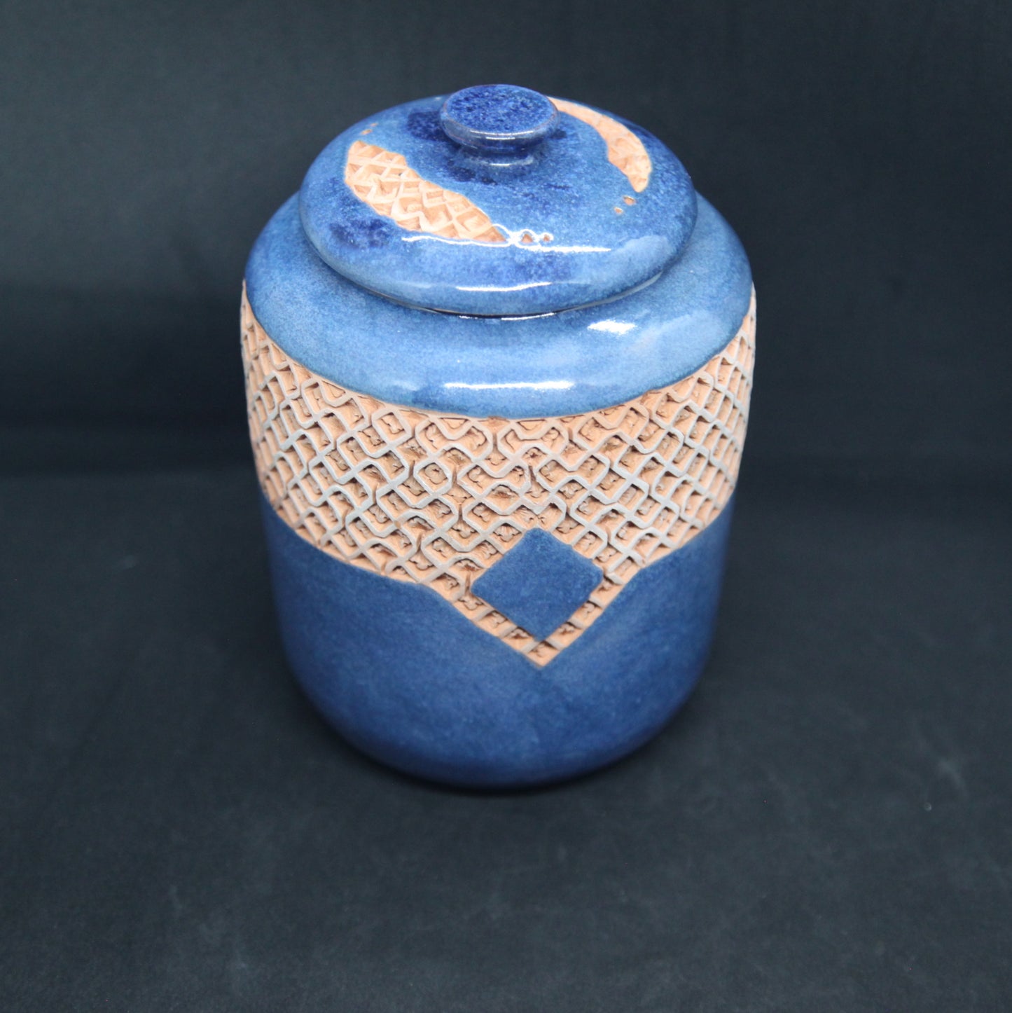 Turquoise blue tea box on red clay - braiding pattern