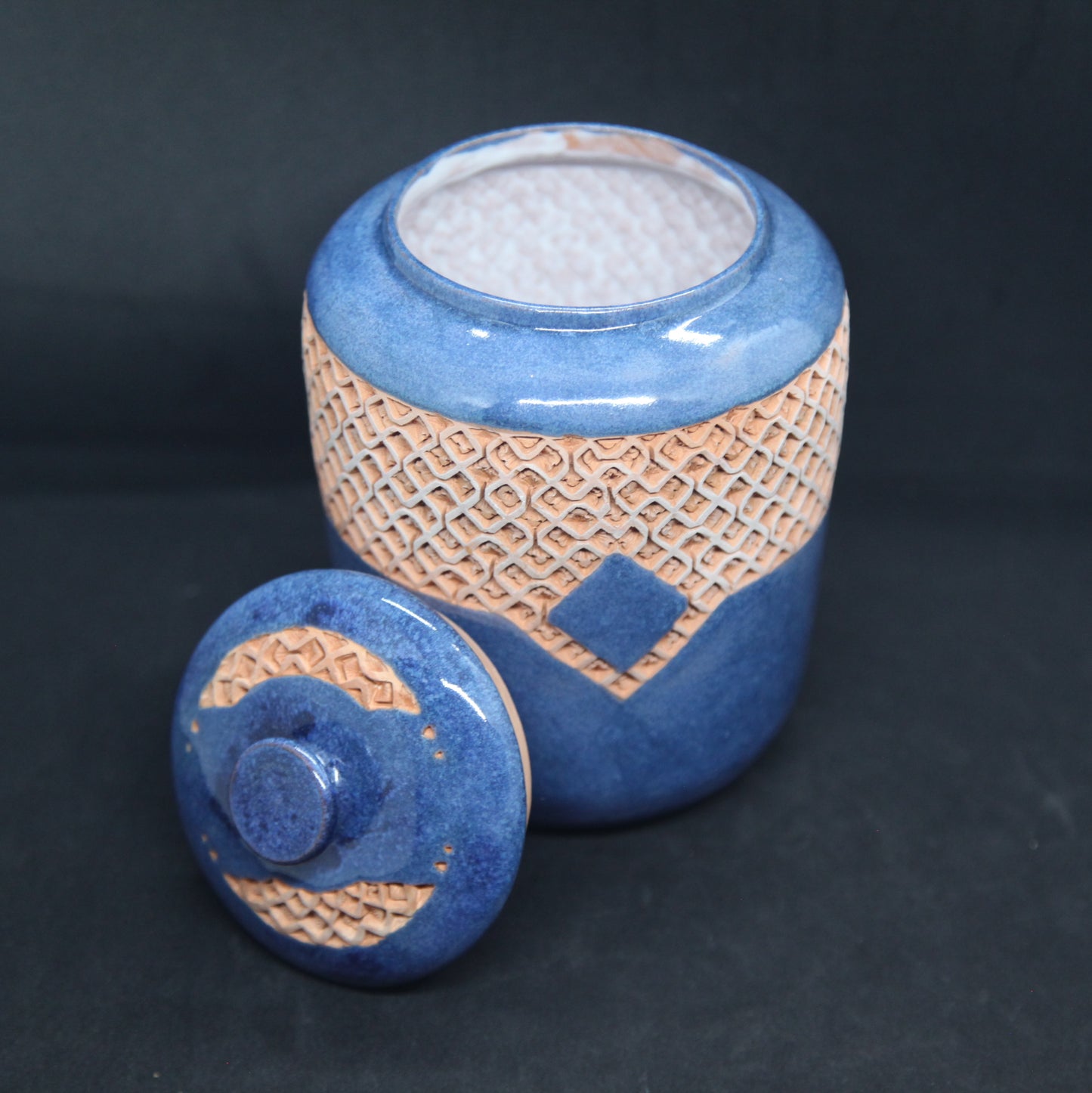 Turquoise blue tea box on red clay - braiding pattern