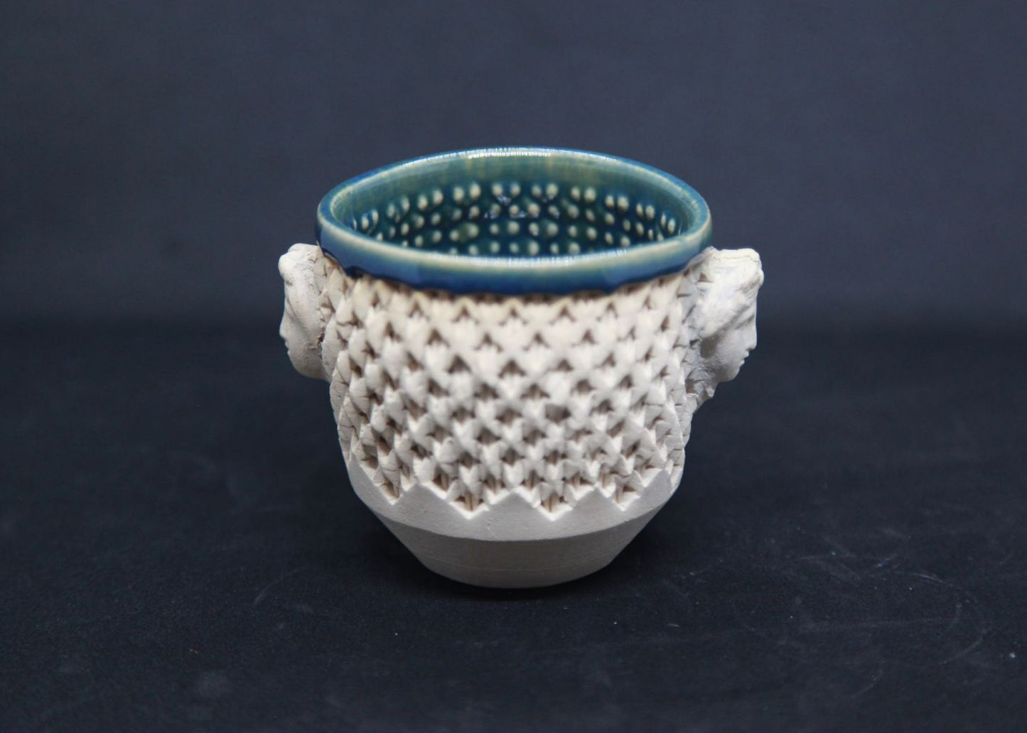 Green cup on white clay, Diane face - braiding pattern