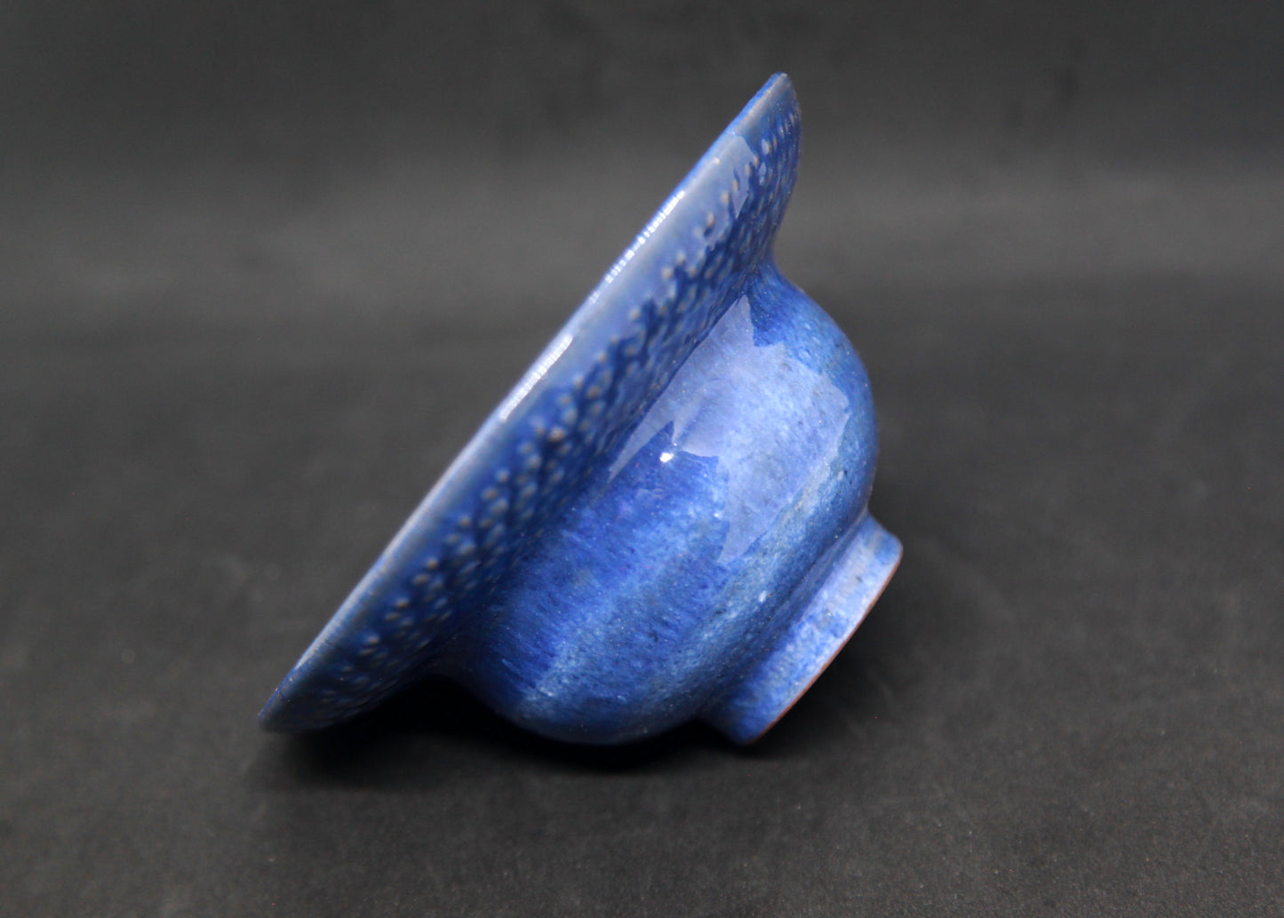 Blue marli bowl on red glaze - braiding pattern
