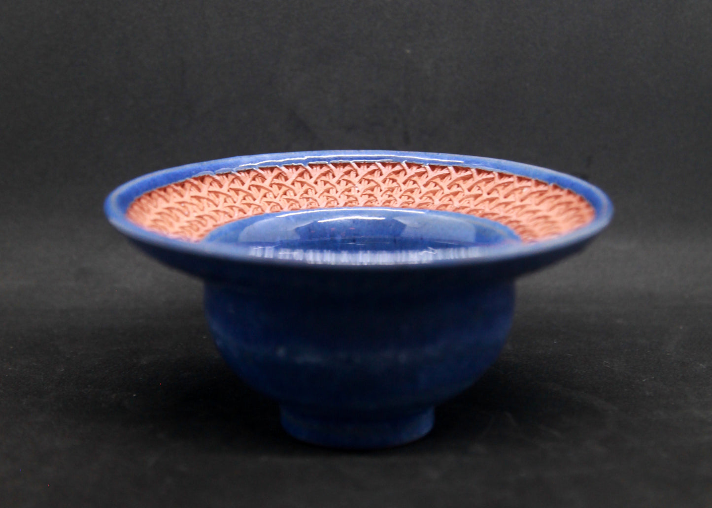 Blue marli bowl on red glaze - braiding pattern