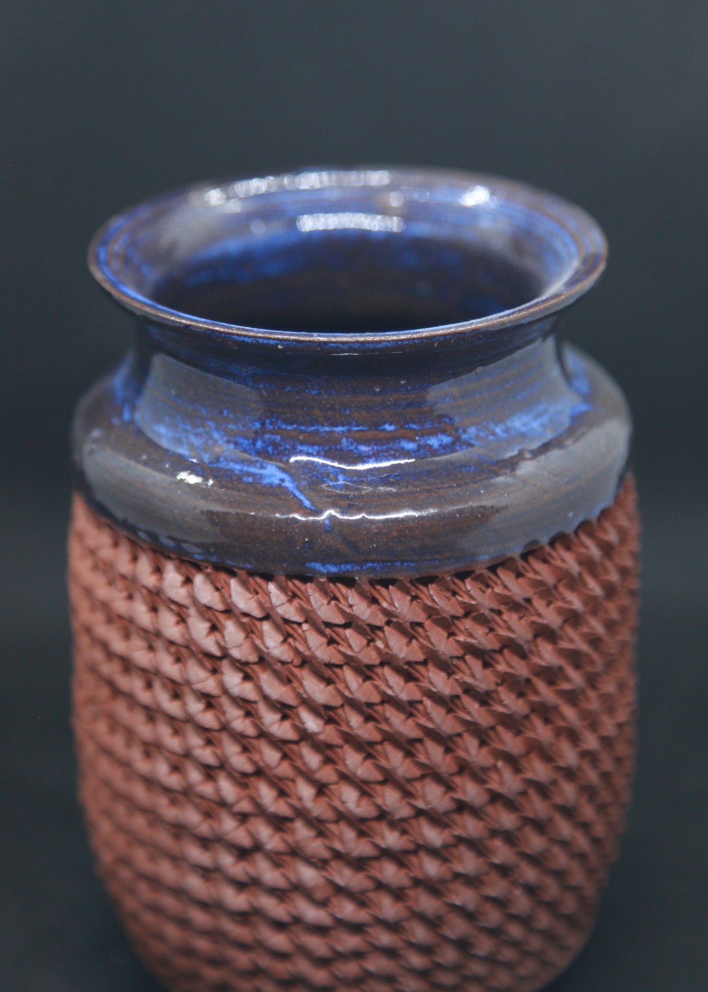 Blue vase on red glaze - braiding pattern