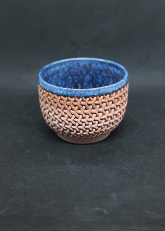 Blue bowl on red glaze - mesh pattern