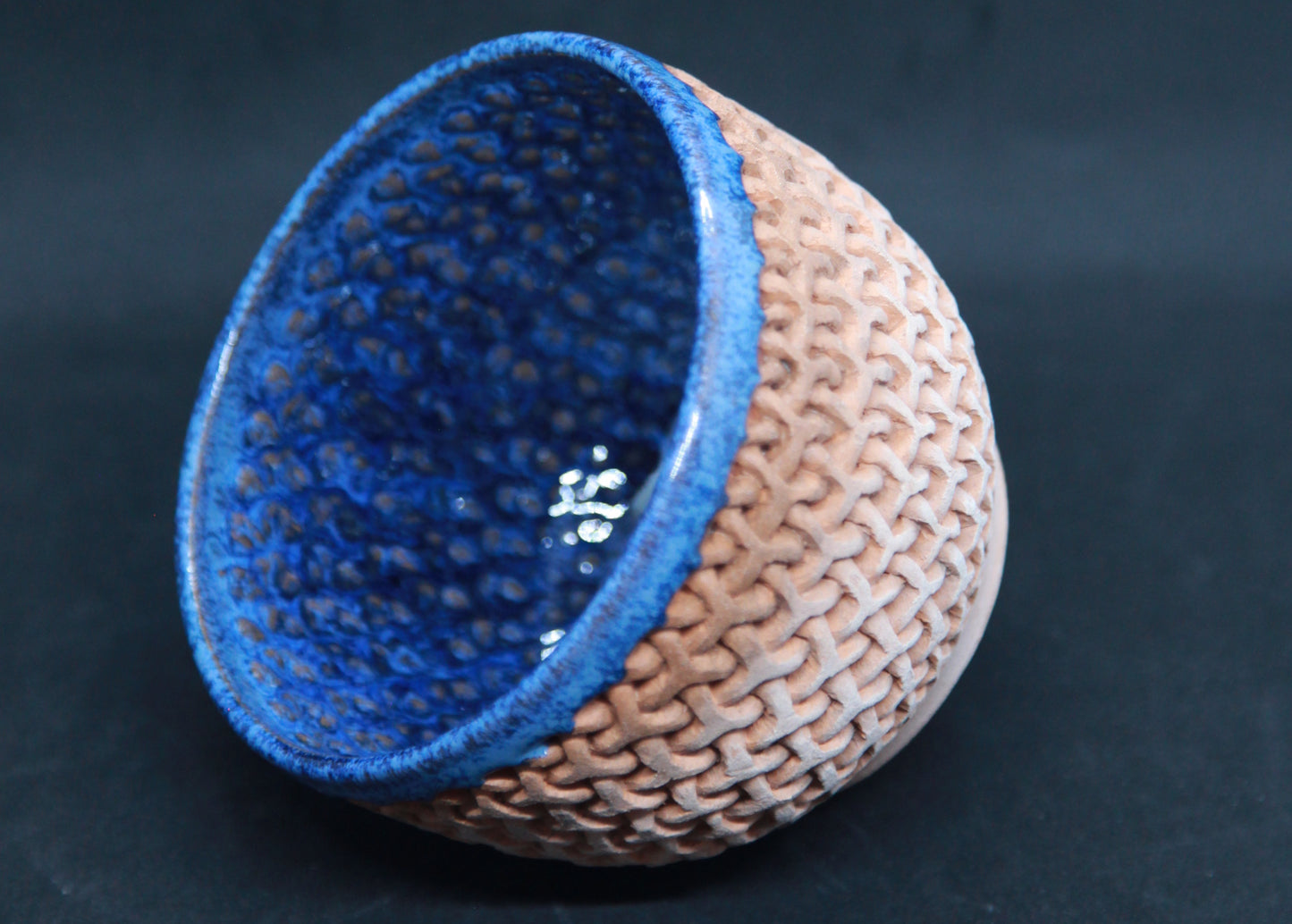 Blue bowl on red glaze - mesh pattern