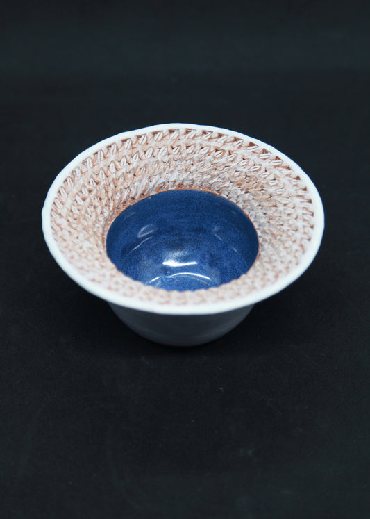 Blue and white marli bowl on red glaze - braiding pattern