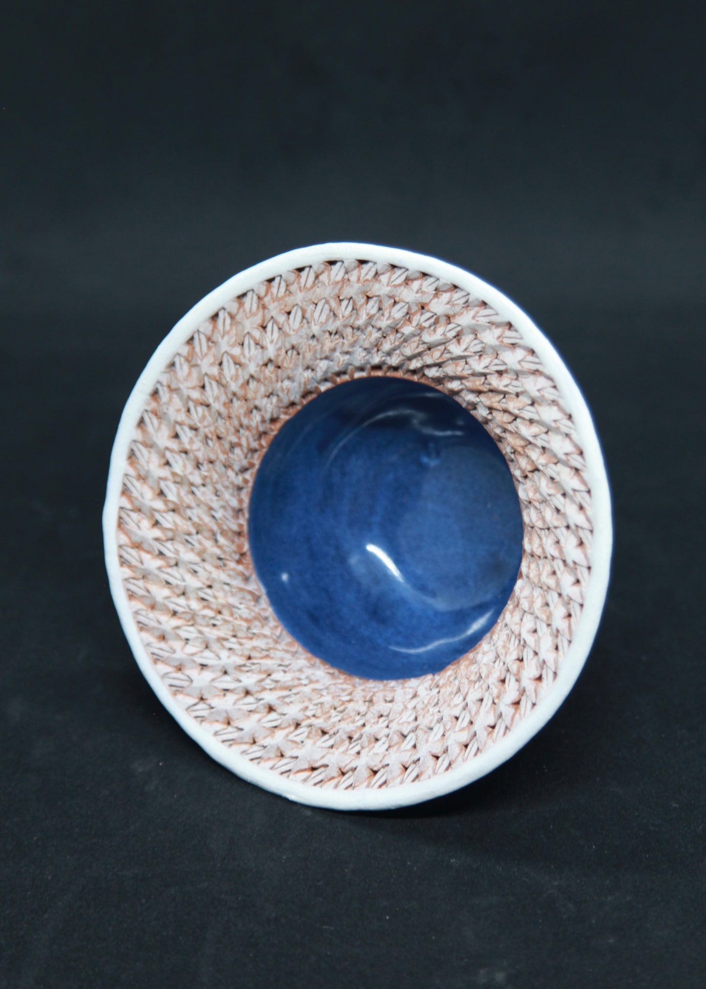 Blue and white marli bowl on red glaze - braiding pattern