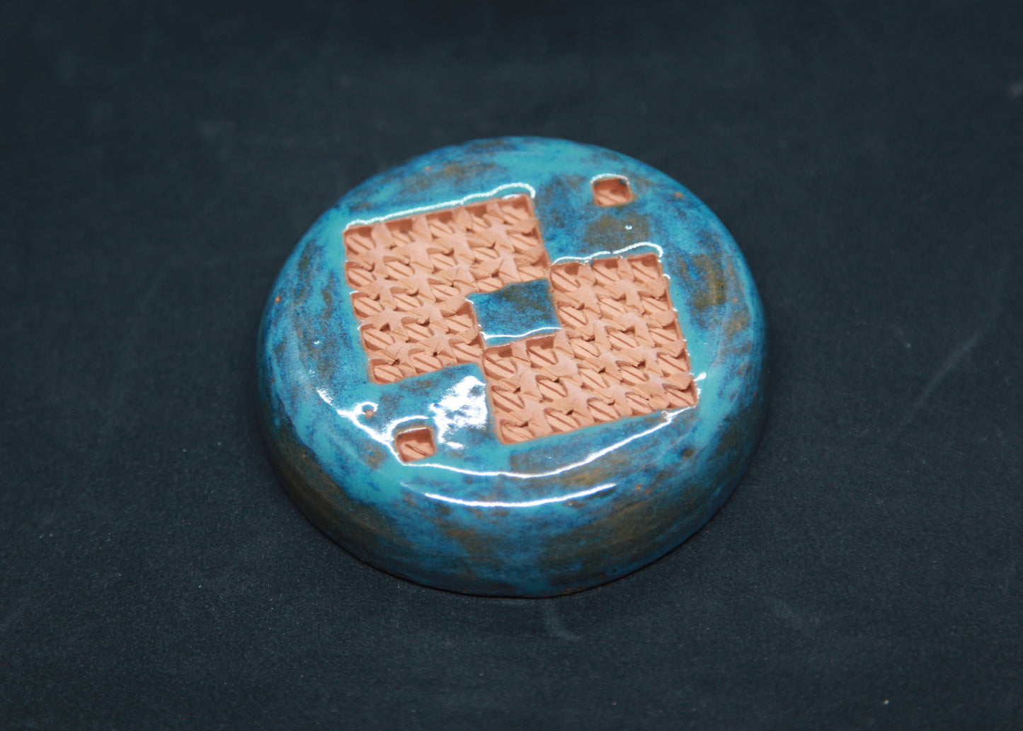 Turquoise blue tea box on red clay - braiding pattern