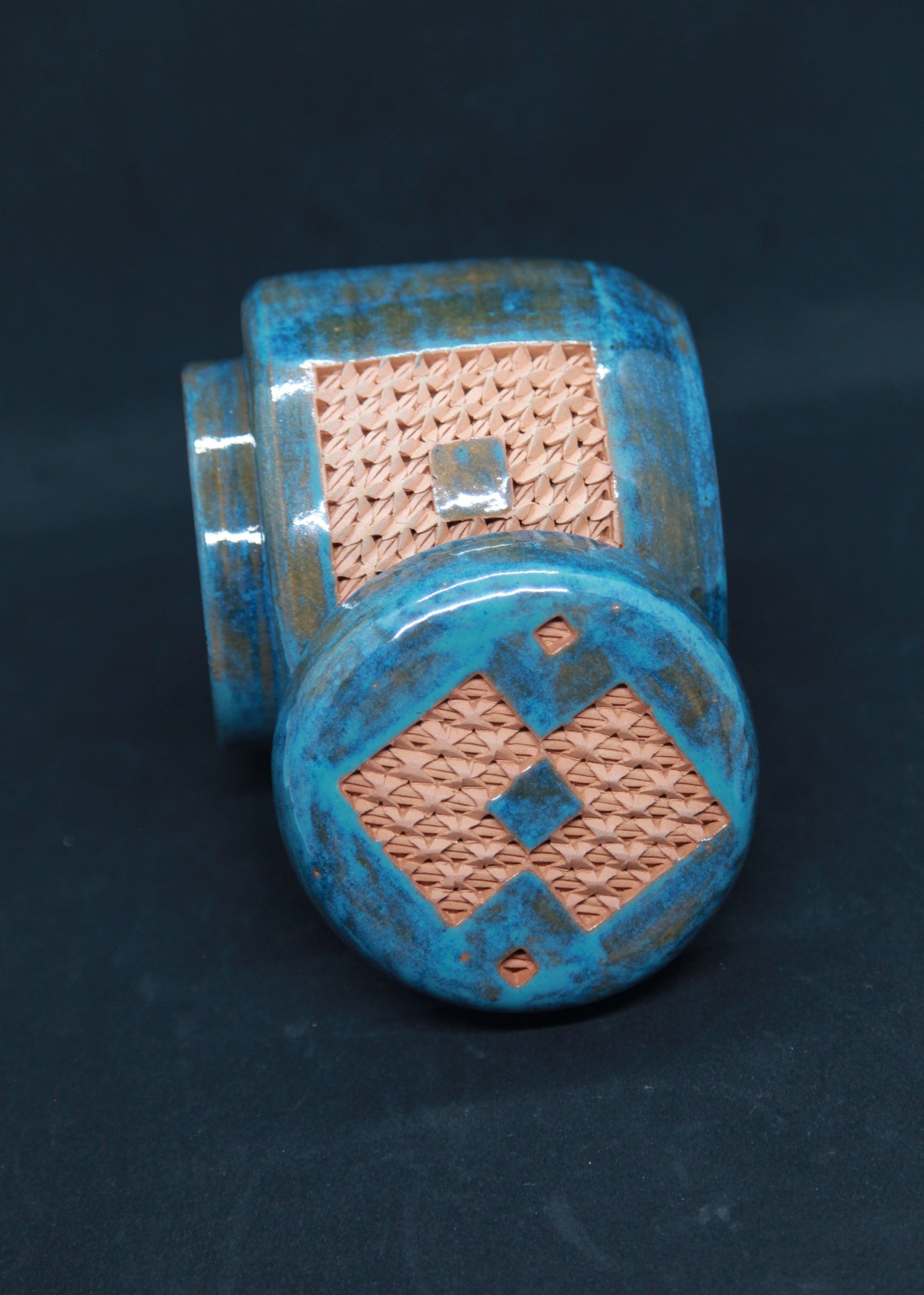 Turquoise blue tea box on red clay - braiding pattern