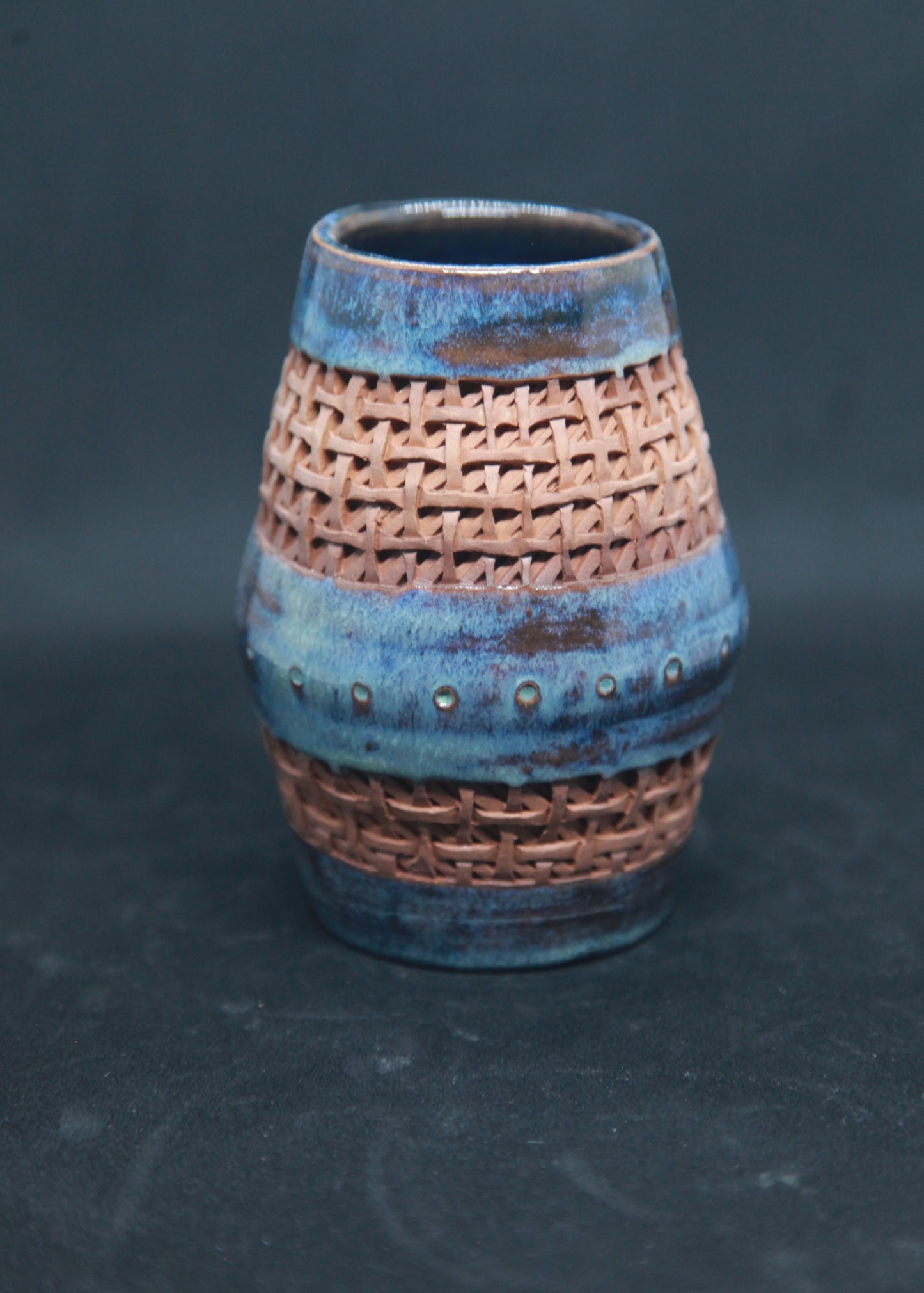 Blue and turquoise vase on red glaze - braiding pattern