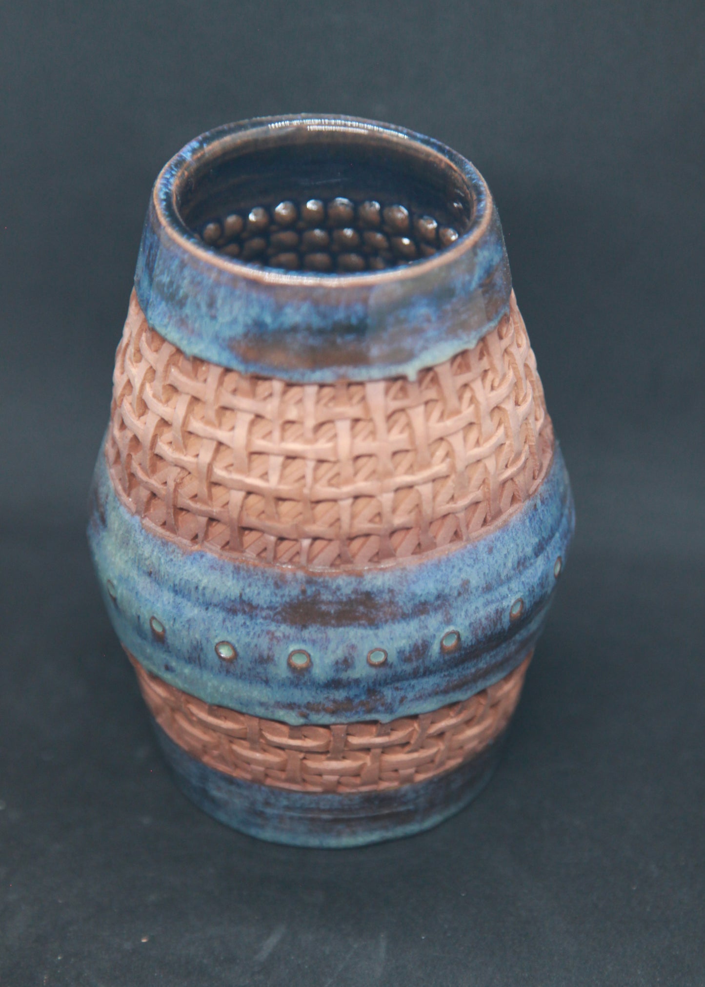 Blue and turquoise vase on red glaze - braiding pattern