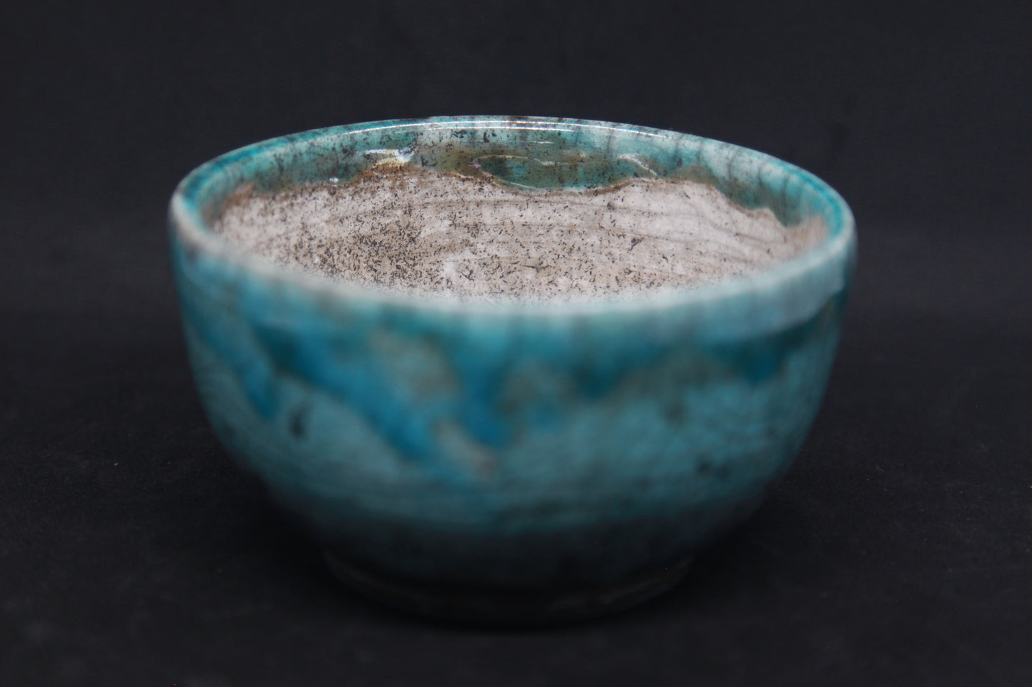 Turquoise and white raku bowl