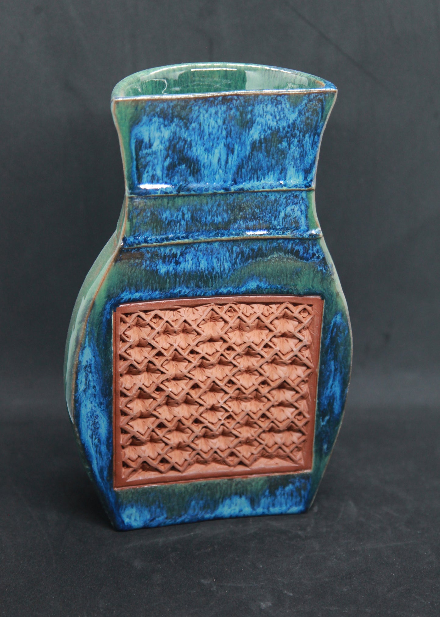 Green and blue vase (half shape) on red glaze - hydrangea pattern